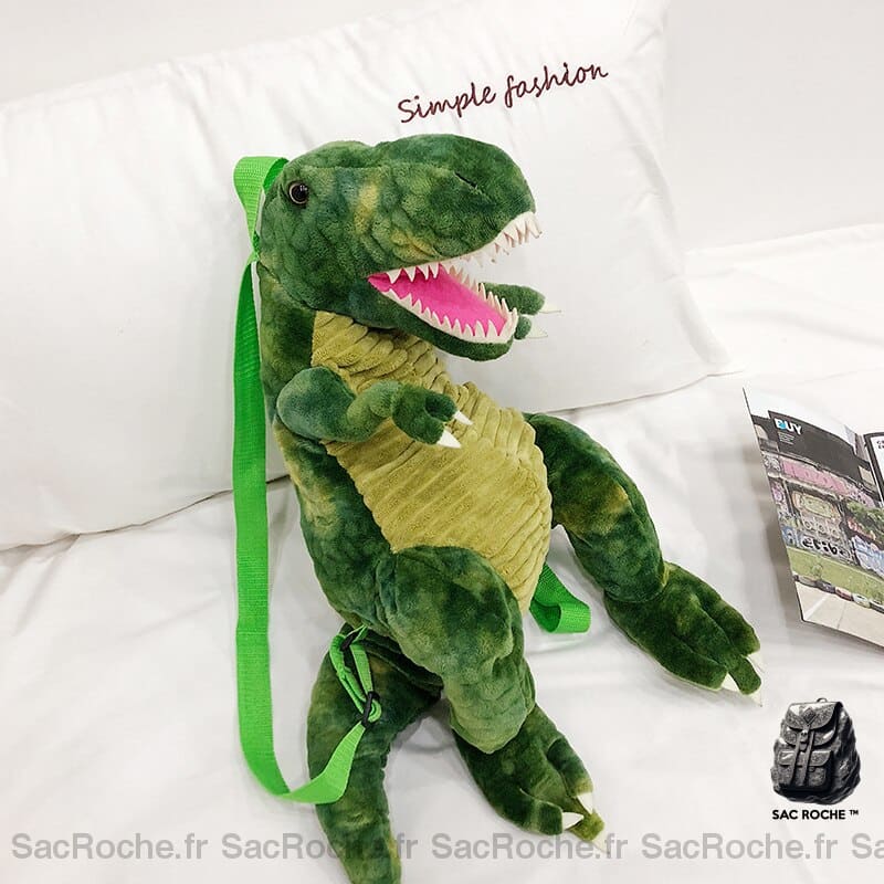 Sac à dos original dinosaure 3D vert dans un lit blanc