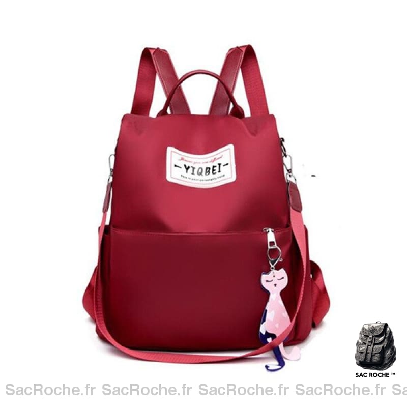 Sac à dos antivol de couleur uni pour femme rouge avec un fond blanc
