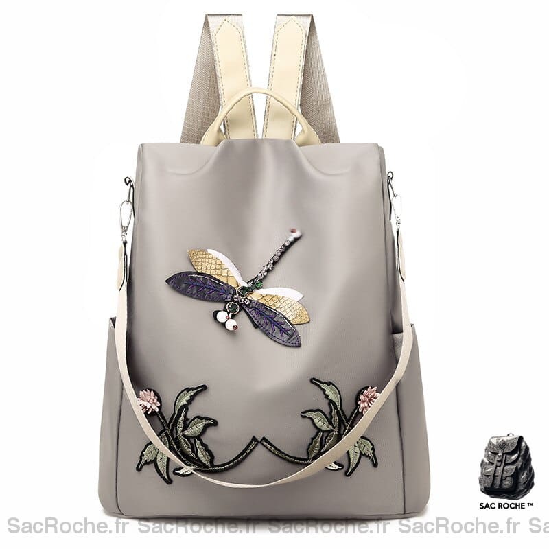 Sac à dos brodé motif fleur et papillon pour femme beige et gris avec un fond blanc