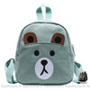 Sac à dos d'école avec tête d'ourson pour enfants vert avec un fond blanc