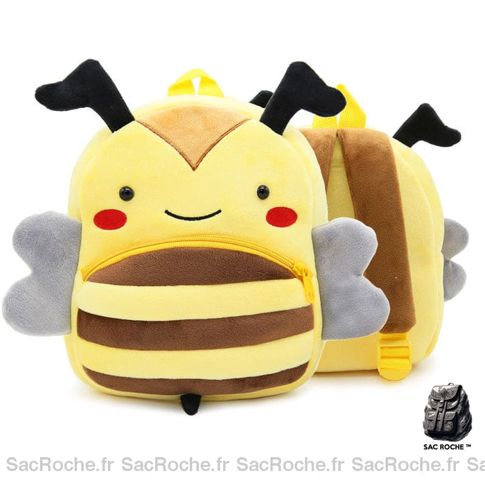 Sac à dos d'écolier en velours en forme d'abeille jaune et marron avec de petites antennes, présenté de face et en arrière plan , le sac est également présenté de dos, où l'on voit les lanières marrons