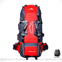 Sac à dos de randonnée étanche rouge et noir avec un fond blanc