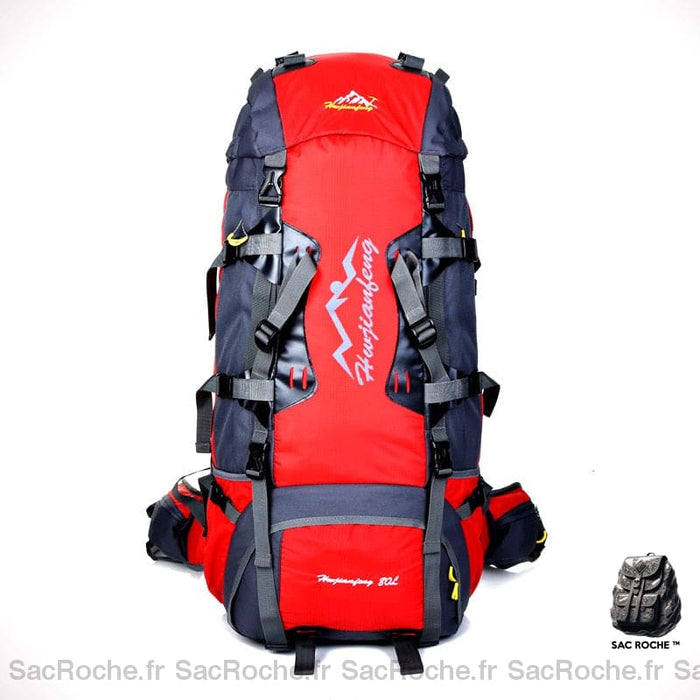 Sac à dos de randonnée étanche rouge et noir avec un fond blanc