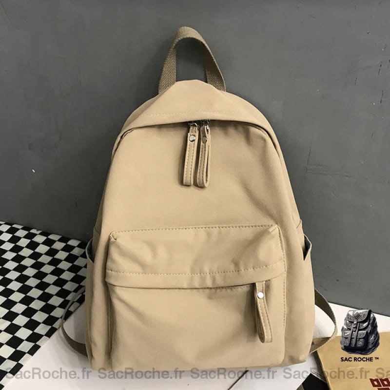 Sac à dos en toile à la mode pour femme marron avec un fond gris