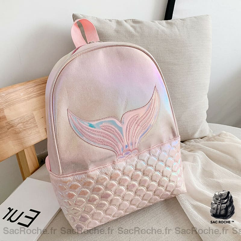 Sac à dos fille motif sirène rose avec un oreiller sur un lit dans une maison