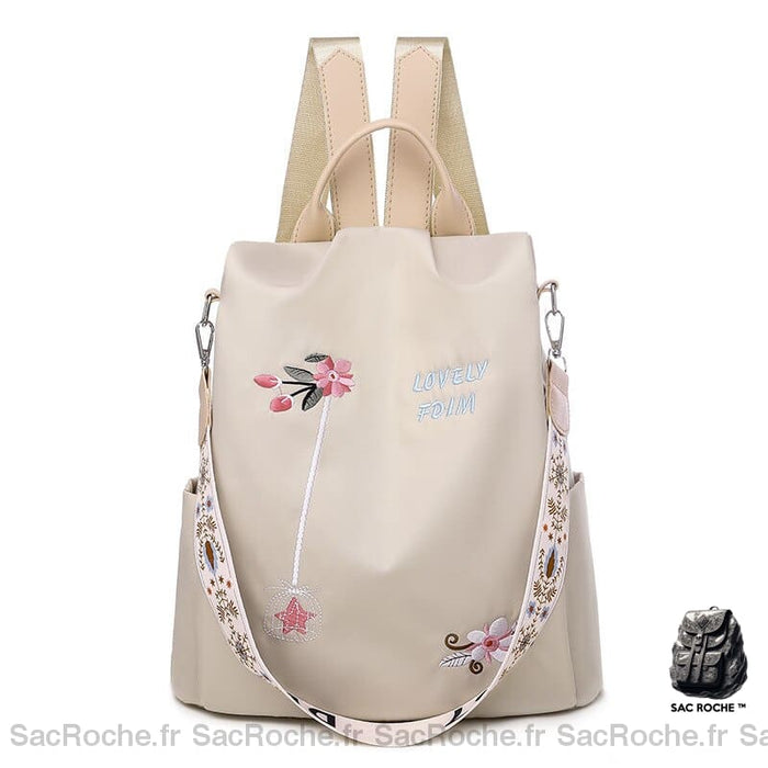 Sac à dos brodé fleurs pour femme beige avec un fond blanc