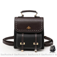 Petit sac à dos vintage noir avec un fond blanc