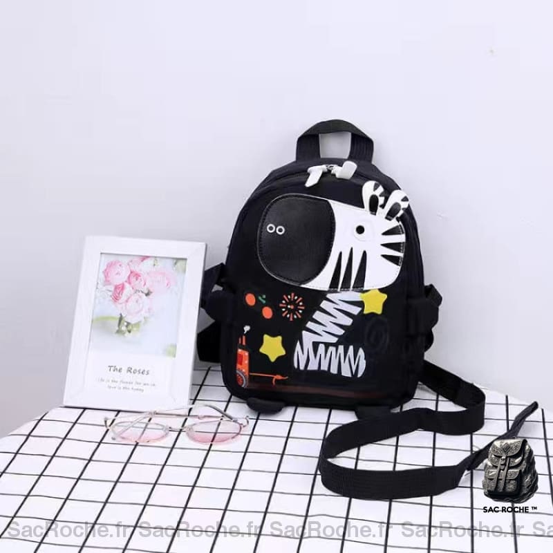 Sac à dos maternelle coloré illustré d'un zèbre en noir sur une table