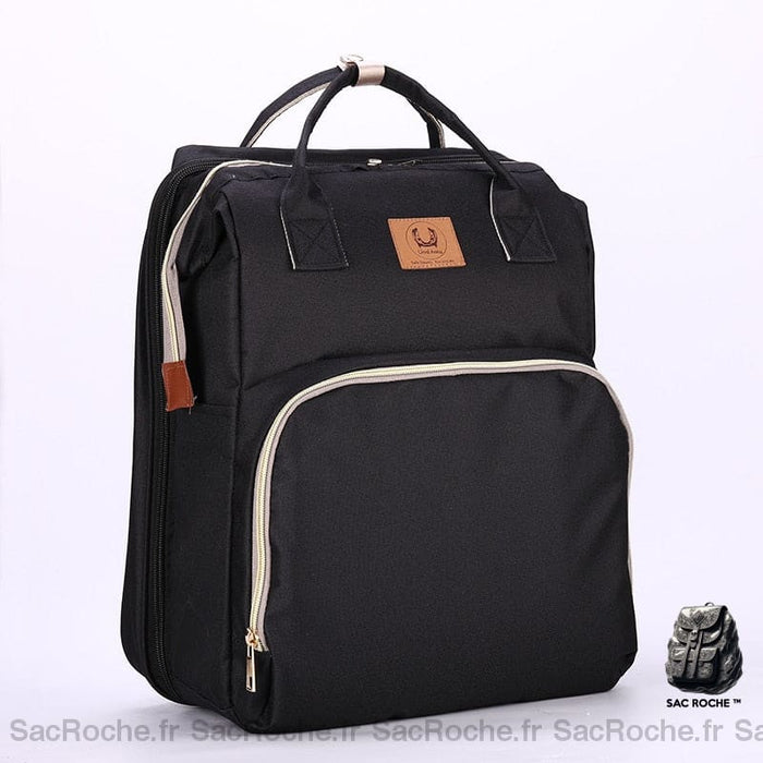 Sac à langer bébé transformable noir avec un fond blanc
