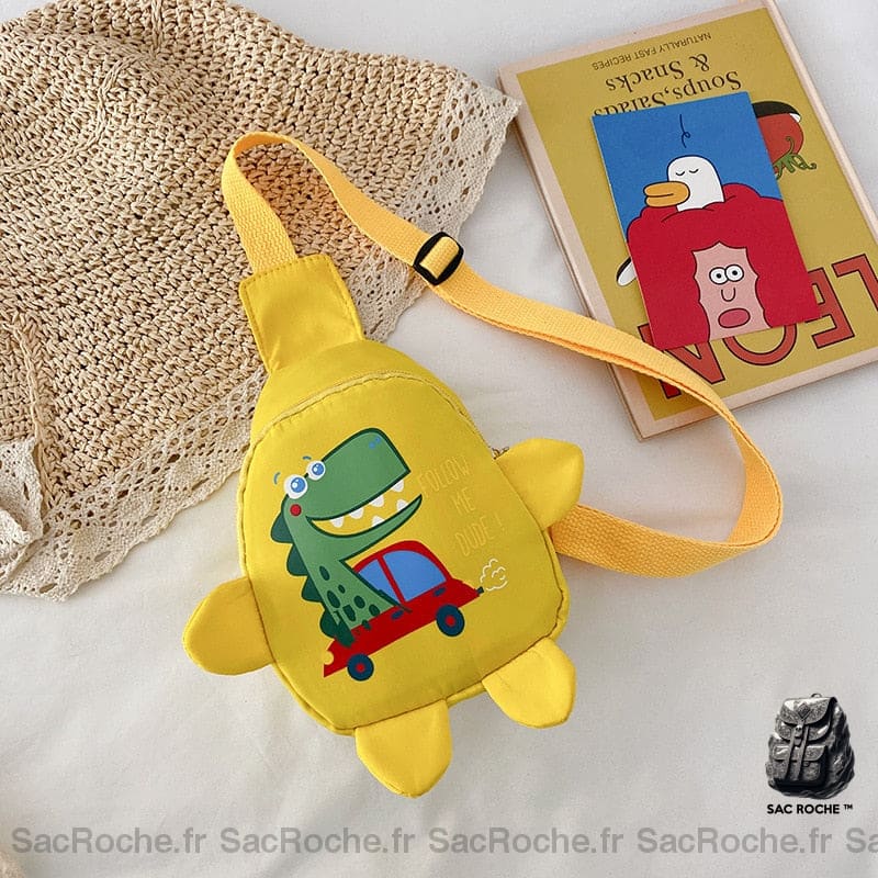 Sac de Maternelle petit dinosaure pour enfant jaune avec un livre à coté