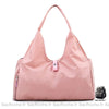 Sac de sport pour femme en nylon rose avec un fond blanc